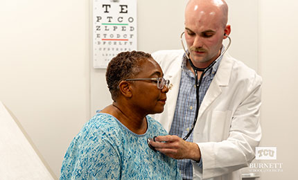 doctor examining patient