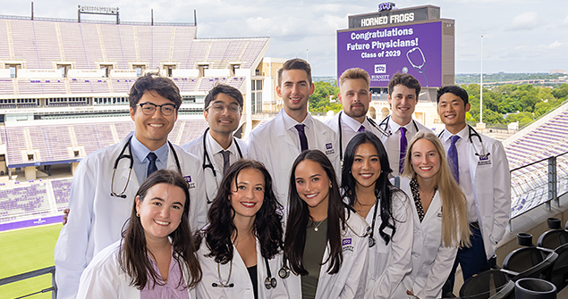 Graduating medical students in white coats