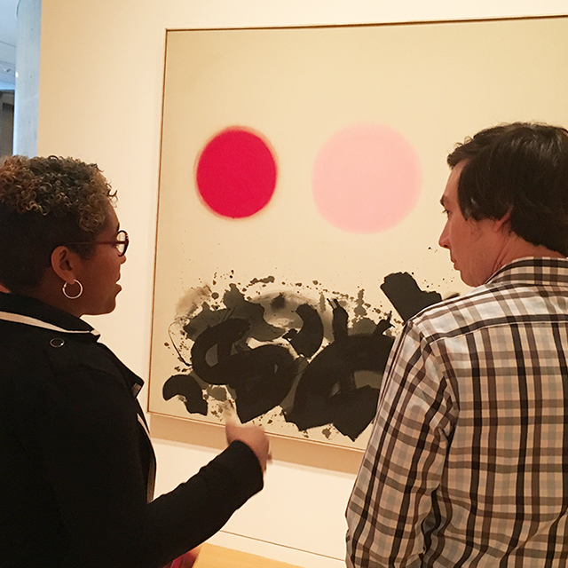 Two TCU students view a painting at Fort Worth's Modern art museum