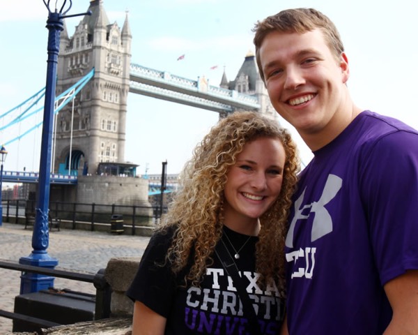 A female and male student standing in front of Tower Bridge in London