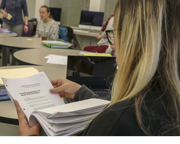 a student looks over a syllabus