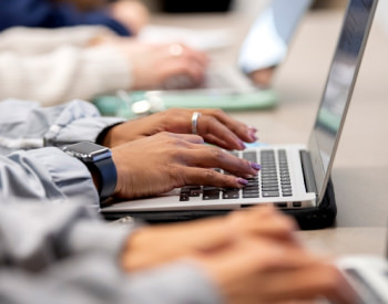 hands on a laptop typing