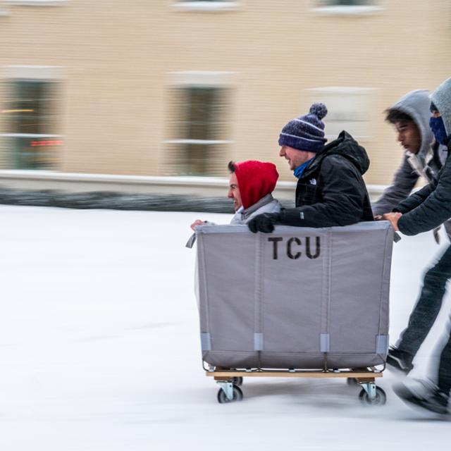 Students playing in snow