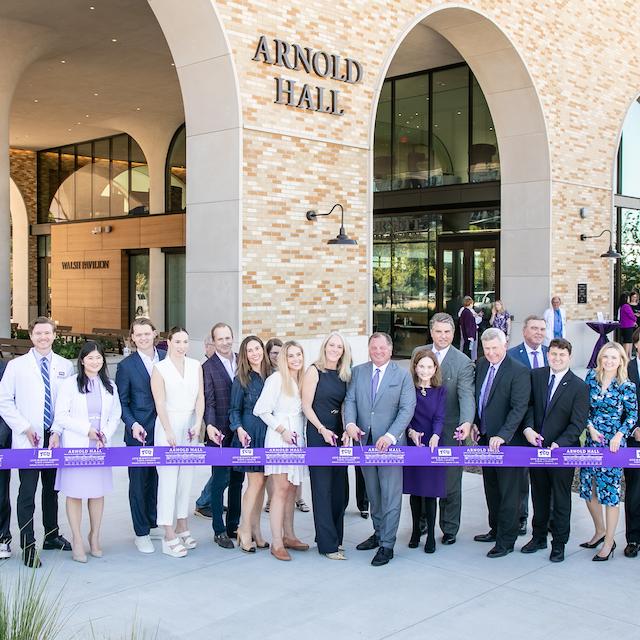 Leaders cut ribbon to Arnold Hall